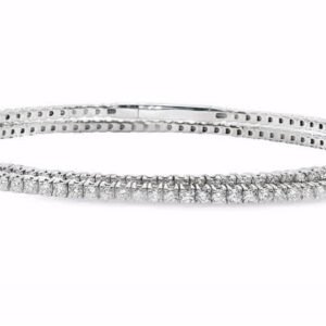 Elevate your style with this stunning flexible bangle. Crafted in 14kt white gold, this bangle showcases a continuous row of round cut diamonds that sparkle with every movement. With its brilliant cut and exceptional symmetry, this timeless piece is the perfect accessory for any occasion. Diamond weight-3.52ct