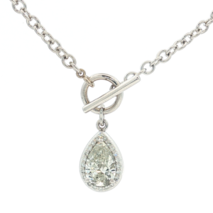 xquisite diamond necklace featuring a brilliant pear-shaped diamond pendant, suspended from a lustrous white gold silver chain. The pendant showcases a timeless design, perfect for adding a touch of elegance to any ensemble. Its composition and arrangement underscore the beauty of diamond.
