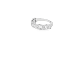 Elevate your style with this exquisite white gold eternity ring, featuring meticulously step-cut emerald diamonds. The ring's timeless design and brilliant sparkle make it a perfect symbol of everlasting love and commitment. Ideal for anniversaries or special occasions, this piece seamlessly blends classic elegance with modern sophistication.