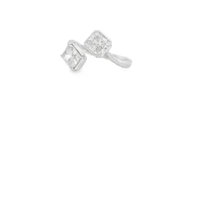 This sophisticated white gold ring features a central princess cut diamond, celebrated for its geometric precision and brilliant cutting style. The main stone is accented by sparkling round diamonds channel-set along the shoulders, creating a seamless stream of radiance. Boasting exceptional clarity and symmetry, this multi-stone arrangement is meticulously polished to enhance the cool tones of the gold, offering a modern and refined aesthetic perfect for special occasions.