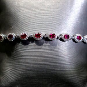 18kt White Gold Tennis Bracelet with Oval Cut Rubies. SKU DDI-345-10049