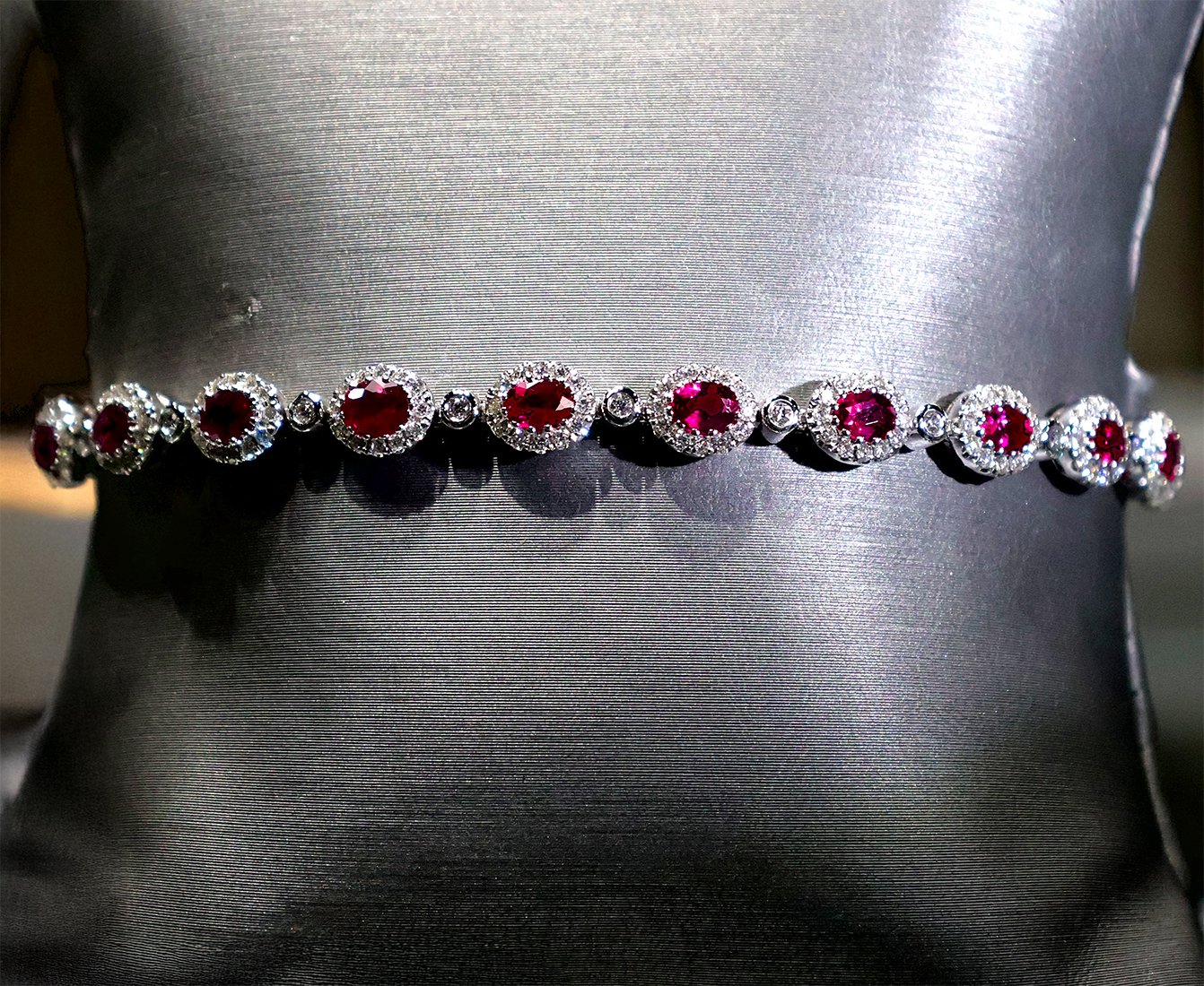 18kt White Gold Tennis Bracelet with Oval Cut Rubies. SKU DDI-345-10049